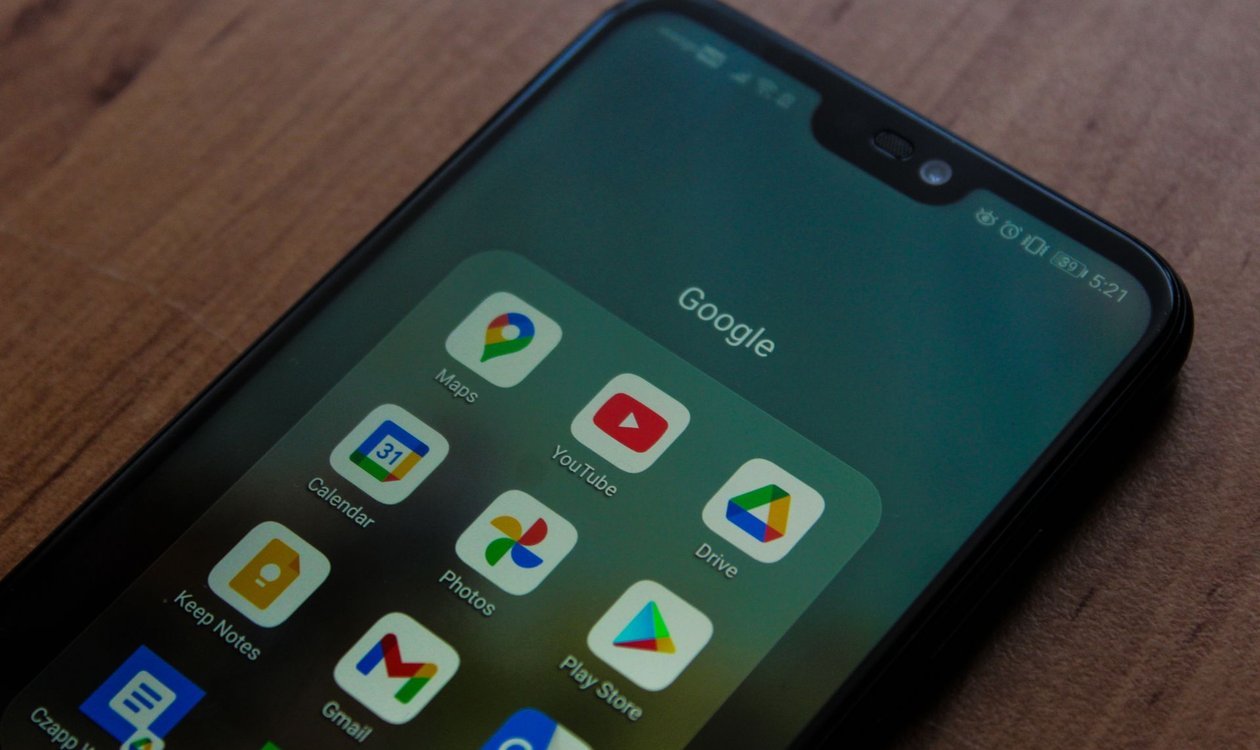 Android phone showing Google apps like Maps, YouTube, and the Play Store