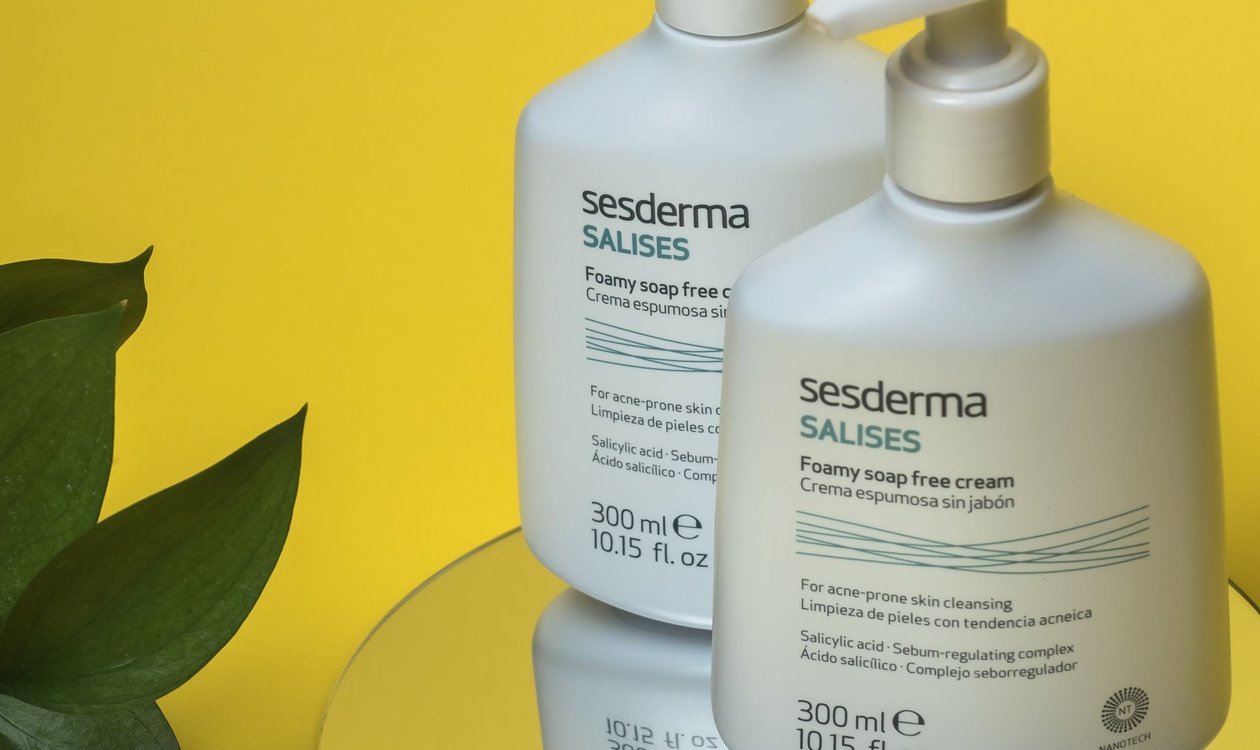 Two pump bottles of gentle skincare products on a bright yellow background