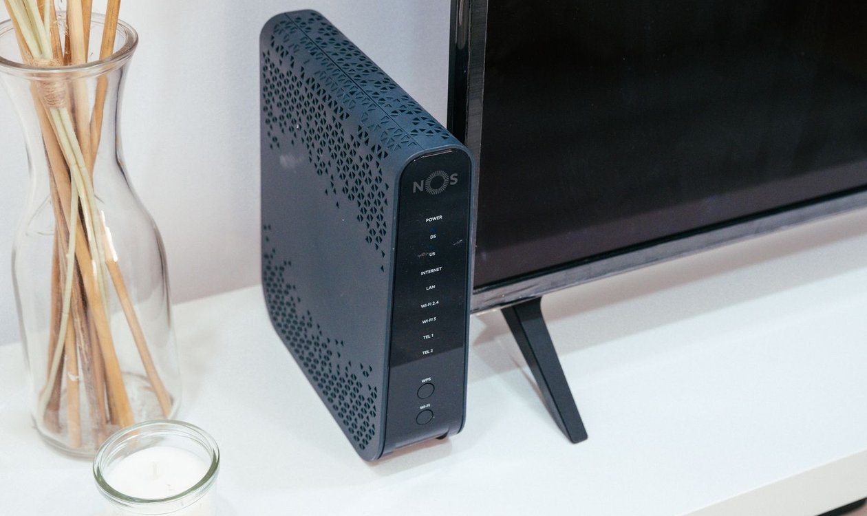 Wi-Fi router set up in a living room next to a television